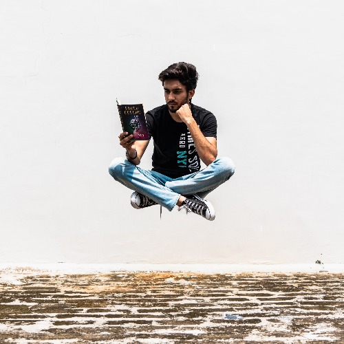 Man floats while reading adventure book